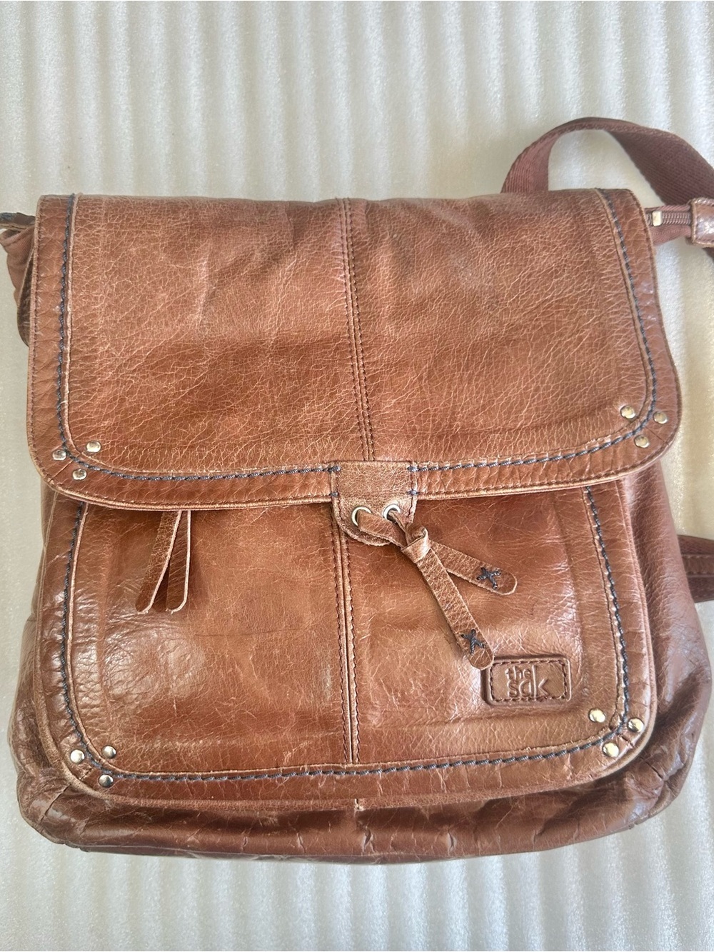 The Sak Cognac Leather Flap Backpack